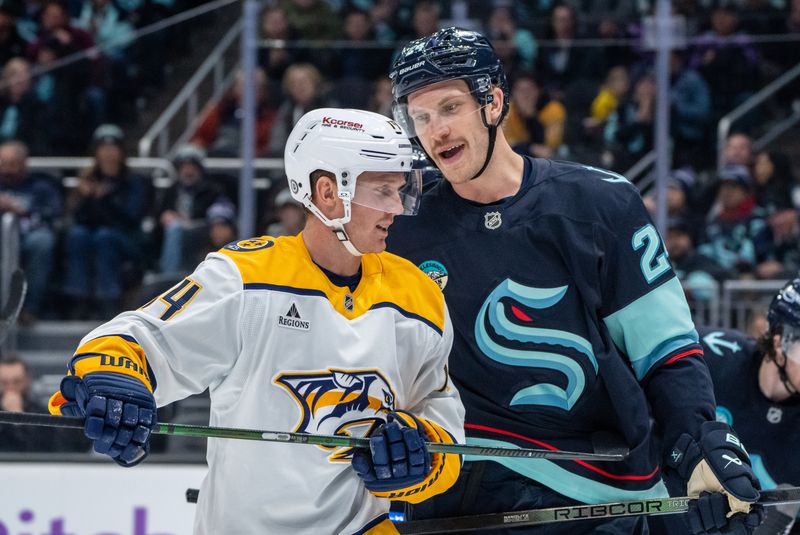 Nov 20, 2024; Seattle, Washington, USA;  Seattle Kraken defenseman Jamie Oleksiak (24), right, scuffles with Nashville Predators forward Gustav Nyquist (14) during the third period at Climate Pledge Arena. Mandatory Credit: Stephen Brashear-Imagn Images