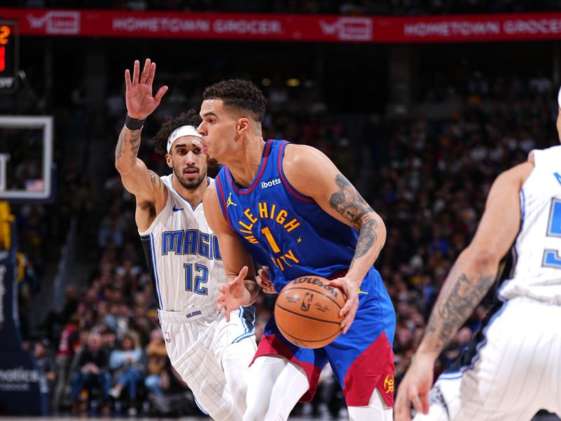 DENVER, CO - JANUARY 5: Michael Porter Jr. #1 of the Denver Nuggets handles the ball during the game against the Orlando Magic on January 5, 2024 at the Ball Arena in Denver, Colorado. NOTE TO USER: User expressly acknowledges and agrees that, by downloading and/or using this Photograph, user is consenting to the terms and conditions of the Getty Images License Agreement. Mandatory Copyright Notice: Copyright 2024 NBAE (Photo by Garrett Ellwood/NBAE via Getty Images)