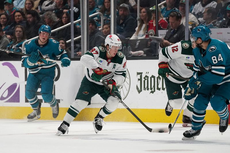 Apr 13, 2024; San Jose, California, USA; Minnesota Wild left wing Kirill Kaprizov (97) controls the puck against the San Jose Sharks during the first period at SAP Center at San Jose. Mandatory Credit: David Gonzales-USA TODAY Sports