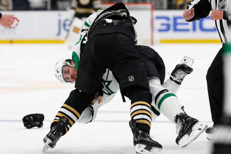 Feb 19, 2024; Boston, Massachusetts, USA; Dallas Stars defenseman Joel Hanley (44) is taken down during a fight with Boston Bruins left wing Brad Marchand (63) during the first period at TD Garden. Mandatory Credit: Winslow Townson-USA TODAY Sports