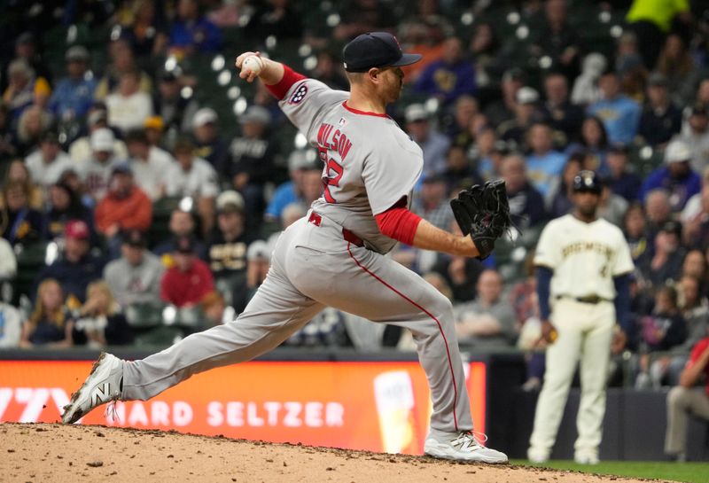 May 27, 2025; Milwaukee, Wisconsin, USA; Boston Red Sox pitcher Justin Wilson (32) delivers a pitch against the Milwaukee Brewers in the seventh inning at American Family Field. Mandatory Credit: Michael McLoone-Imagn Images