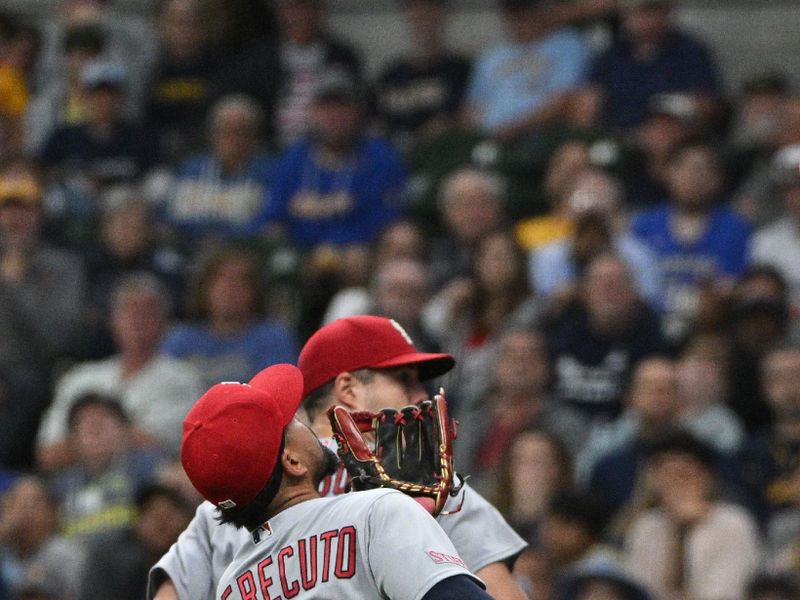 Sep 28, 2023; Milwaukee, Wisconsin, USA; St. Louis Cardinals third baseman Juniel Querecuto (62) makes a catch in the infield agains the Milwaukee Brewers in the fifth inning at American Family Field. Mandatory Credit: Michael McLoone-USA TODAY Sports