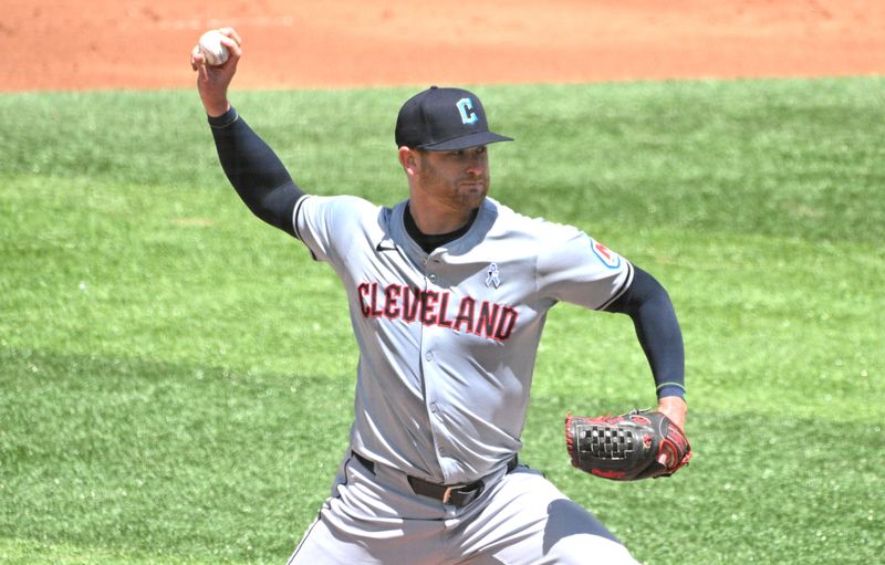 Jun 16, 2024; Toronto, Ontario, CAN;  Cleveland Guardians starting pitcher Ben Lively (39) delivers a pitch against the Toronto Blue Jays in the first inning at Rogers Centre. Mandatory Credit: Dan Hamilton-USA TODAY Sports