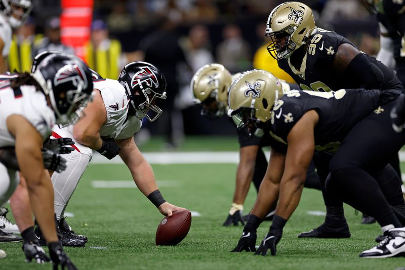 The Atlanta Falcons offense lines up at the line of scrimmage against the New Orleans Saints defense during an NFL football game, Sunday, Jan. 7, 2024, in New Orleans. (AP Photo/Tyler Kaufman)