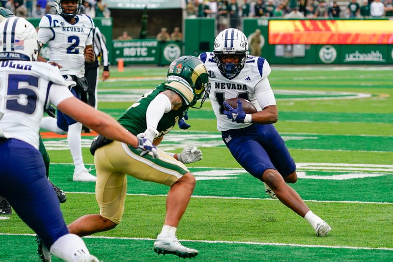 Nov 18, 2023; Fort Collins, Colorado, USA;  Nevada Wolf Pack wide receiver John Jackson III (14) runs after a catch in the third quarter against the Colorado State Rams at Sonny Lubick Field at Canvas Stadium. Mandatory Credit: Michael Madrid-USA TODAY Sports