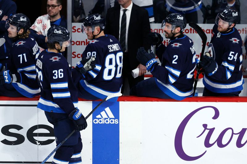 Jan 2, 2024; Winnipeg, Manitoba, CAN; Winnipeg Jets center Morgan Barron (36) celebrates his third period goal against the Tampa Bay Lightning at Canada Life Centre. Mandatory Credit: James Carey Lauder-USA TODAY Sports