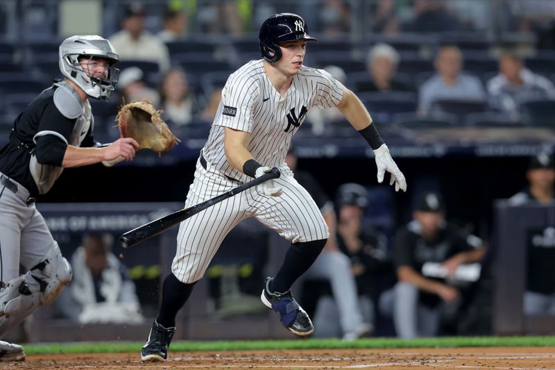 Sep 25, 2025; Bronx, New York, USA; New York Yankees first baseman Ben Rice (22) follows through on an RBI ground out against the Chicago White Sox during the first inning at Yankee Stadium. Mandatory Credit: Brad Penner-Imagn Images