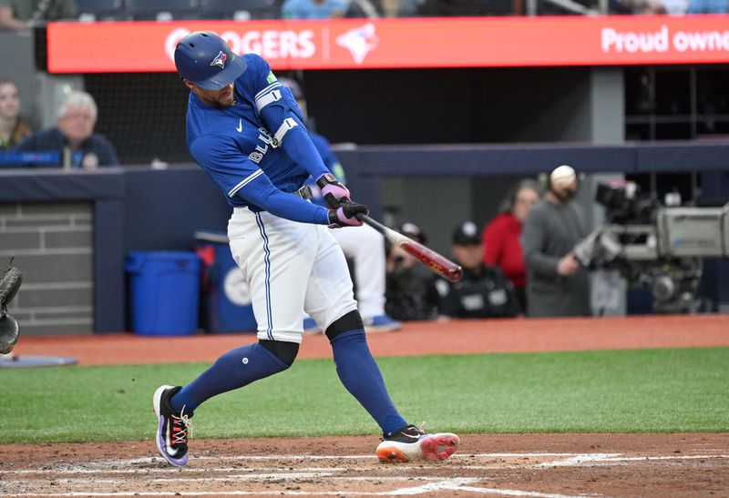 Jul 2, 2024; Toronto, Ontario, CAN;  Toronto Blue Jays right fielder George Springer (4) hits a three run home run against the Houston Astros in the third inning at Rogers Centre. Mandatory Credit: Dan Hamilton-USA TODAY Sports