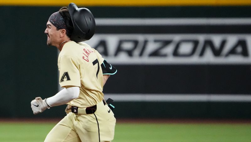 Aug 13, 2024; Phoenix, Arizona, USA; Arizona Diamondbacks outfielder Corbin Carroll (7) runs to third base en route to a triple against the Colorado Rockies during the ninth inning at Chase Field. Mandatory Credit: Joe Camporeale-USA TODAY Sports