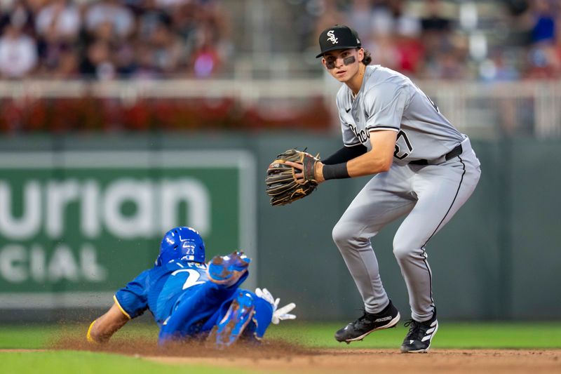 Aug 2, 2024; Minneapolis, Minnesota, USA; Chicago White Sox shortstop Brooks Baldwin (27) forces out Minnesota Twins designated hitter Royce Lewis (23) sliding into second base in the fifth inning at Target Field. Mandatory Credit: Jesse Johnson-USA TODAY Sports