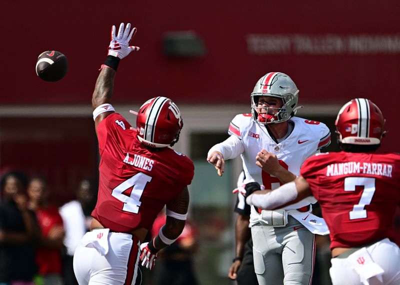 Sep 2, 2023; Bloomington, Indiana, USA; Ohio State Buckeyes quarterback Kyle McCord (6) passes the ball over Indiana Hoosiers linebacker Anthony Jones (4) during the first quarter at Memorial Stadium. Mandatory Credit: Marc Lebryk-USA TODAY Sports