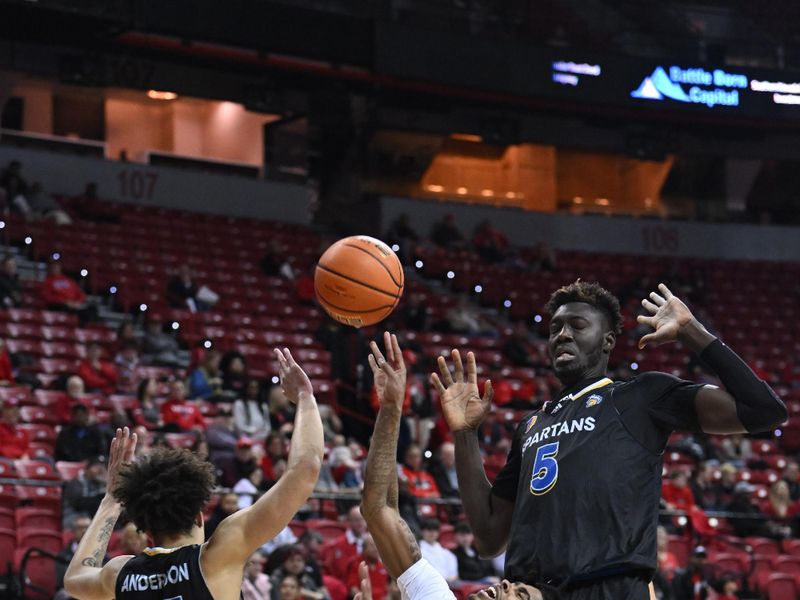 Feb 14, 2023; Las Vegas, Nevada, USA; UNLV Runnin' Rebels guard Keshon Gilbert (10) collides with San Jose State Spartans forward Trey Anderson (15) and center Ibrahima Diallo (5) in the first half at Thomas & Mack Center. Mandatory Credit: Candice Ward-USA TODAY Sports