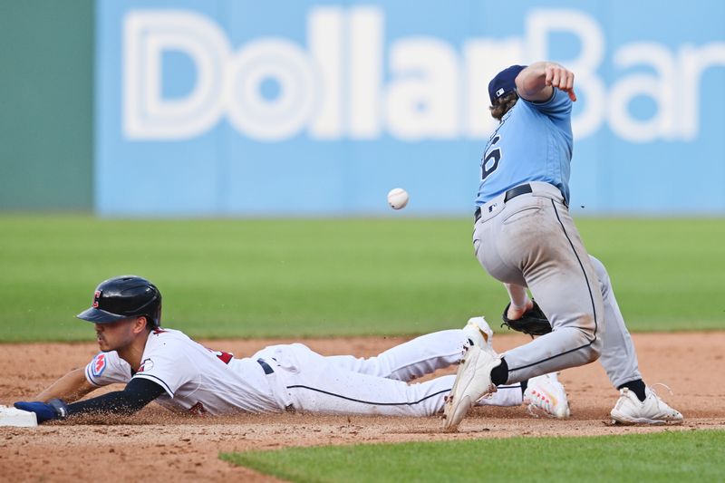 Sep 3, 2023; Cleveland, Ohio, USA; Cleveland Guardians left fielder Steven Kwan (38) steals second as Tampa Bay Rays shortstop Taylor Walls (6) can not catch the throw during the seventh inning Progressive Field. Mandatory Credit: Ken Blaze-USA TODAY Sports