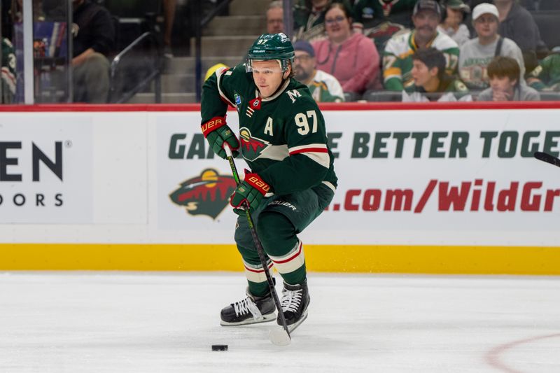 Oct 1, 2024; Saint Paul, Minnesota, USA; Minnesota Wild left wing Kirill Kaprizov (97) skates with the puck against the Chicago Blackhawks in the first period at Xcel Energy Center. Mandatory Credit: Matt Blewett-Imagn Images