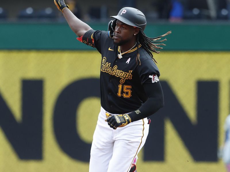 May 12, 2024; Pittsburgh, Pennsylvania, USA;  Pittsburgh Pirates shortstop Oneil Cruz (15) circles the bases on a solo home run against the Chicago Cubs during the fourth inning at PNC Park. Mandatory Credit: Charles LeClaire-USA TODAY Sports