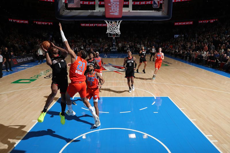 OKLAHOMA CITY, OK - MARCH 27:  Amen Thompson #1 of the Houston Rockets drives to the basket during the game against the Oklahoma City Thunder on March 27, 2024 at Paycom Arena in Oklahoma City, Oklahoma. NOTE TO USER: User expressly acknowledges and agrees that, by downloading and or using this photograph, User is consenting to the terms and conditions of the Getty Images License Agreement. Mandatory Copyright Notice: Copyright 2024 NBAE (Photo by Zach Beeker/NBAE via Getty Images)