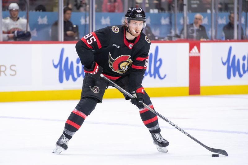 Apr 4, 2024; Ottawa, Ontario, CAN; Ottawa Senators defenseman Jake Sanderson (85) skates with the puck in the first period against the  Florida Panthers at the Canadian Tire Centre. Mandatory Credit: Marc DesRosiers-USA TODAY Sports