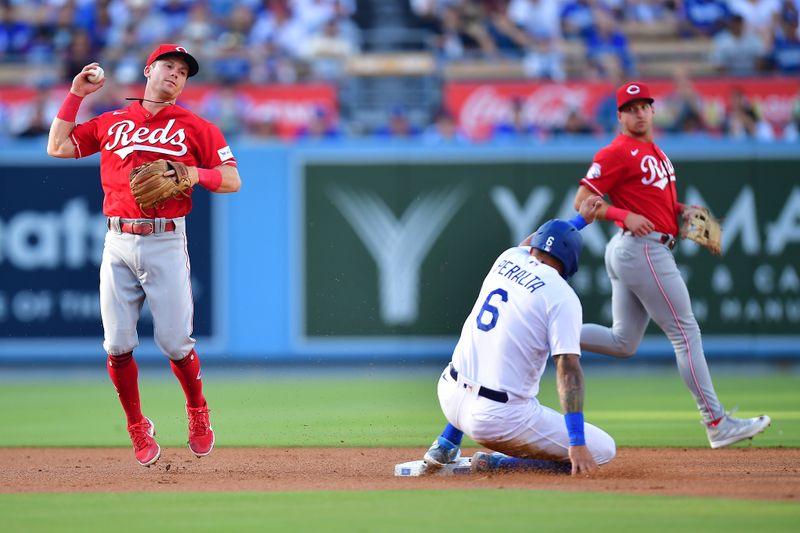 Jul 29, 2023; Los Angeles, California, USA; Los Angeles Dodgers left fielder David Peralta (6) is out at second as Cincinnati Reds second baseman Matt McLain (9) is late on the throw to first during the first inning at Dodger Stadium. Mandatory Credit: Gary A. Vasquez-USA TODAY Sports