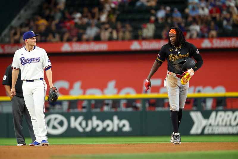 Aug 20, 2024; Arlington, Texas, USA; Pittsburgh Pirates designated hitter Oneil Cruz (15) speaks with Texas Rangers shortstop Corey Seager (5) during the seventh inning at Globe Life Field. Mandatory Credit: Kevin Jairaj-USA TODAY Sports