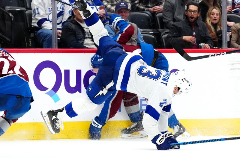 Nov 27, 2023; Denver, Colorado, USA; Colorado Avalanche defenseman Jack Johnson (3) hits Tampa Bay Lightning center Michael Eyssimont (23) during the third period at Ball Arena. Mandatory Credit: Ron Chenoy-USA TODAY Sports