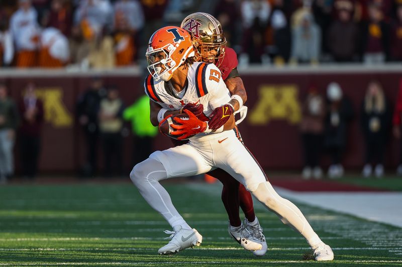 Nov 4, 2023; Minneapolis, Minnesota, USA; Minnesota Golden Gophers defensive back Justin Walley (5) tackles Illinois Fighting Illini wide receiver Pat Bryant (13) during the second half at Huntington Bank Stadium. Mandatory Credit: Matt Krohn-USA TODAY Sports