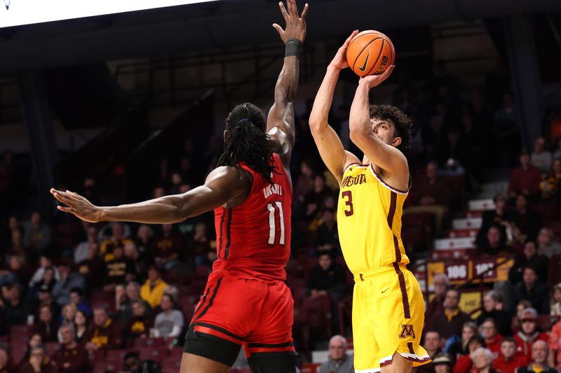 Mar 2, 2023; Minneapolis, Minnesota, USA; Minnesota Golden Gophers forward Dawson Garcia (3) shoots while Rutgers Scarlet Knights center Clifford Omoruyi (11) defends during the first half at Williams Arena. Mandatory Credit: Matt Krohn-USA TODAY Sports