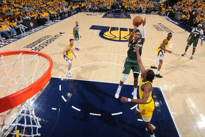 INDIANAPOLIS, IN - APRIL 26:  Khris Middleton #22 of the Milwaukee Bucks shoots the ball during the game against the Indiana Pacers during Round 1 Game 3 of the 2024 NBA Playoffs on April 26, 2024 at Gainbridge Fieldhouse in Indianapolis, Indiana. NOTE TO USER: User expressly acknowledges and agrees that, by downloading and or using this Photograph, user is consenting to the terms and conditions of the Getty Images License Agreement. Mandatory Copyright Notice: Copyright 2024 NBAE (Photo by Ron Hoskins/NBAE via Getty Images)