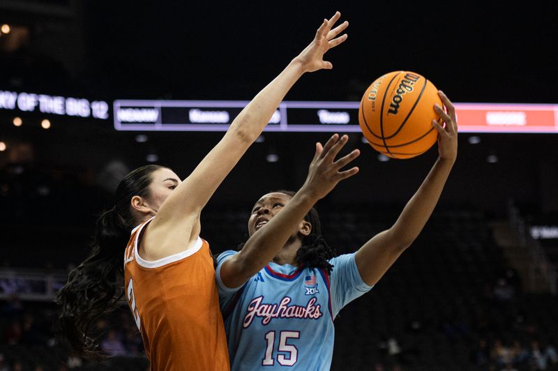 Mar 9, 2024; Kansas City, MO, USA; Kansas Jayhawks guard Zakiyah Franklin (15) shoots the ball while defended by Texas Longhorns guard Shaylee Gonzales (2) during the first half at T-Mobile Center. Mandatory Credit: Amy Kontras-USA TODAY Sports