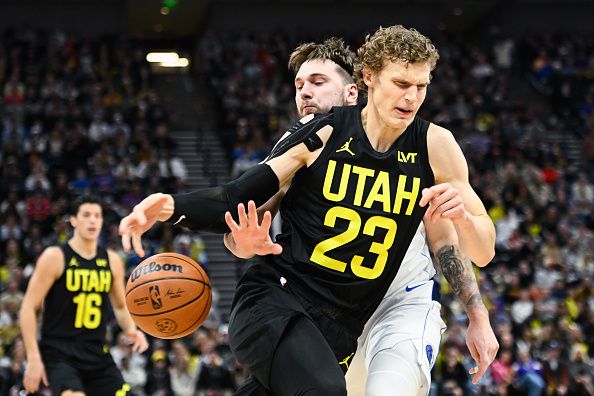 SALT LAKE CITY, UTAH - JANUARY 01: Luka Doncic #77 of the Dallas Mavericks knocks the ball from Lauri Markkanen #23 of the Utah Jazz's hands during the first half of a game at Delta Center on January 01, 2024 in Salt Lake City, Utah. NOTE TO USER: User expressly acknowledges and agrees that, by downloading and or using this photograph, User is consenting to the terms and conditions of the Getty Images License Agreement. (Photo by Alex Goodlett/Getty Images)