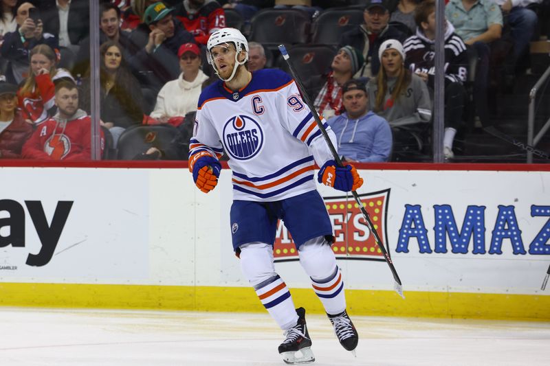 Dec 21, 2023; Newark, New Jersey, USA; Edmonton Oilers center Connor McDavid (97) celebrates his goal against the New Jersey Devils during the third period at Prudential Center. Mandatory Credit: Ed Mulholland-USA TODAY Sports