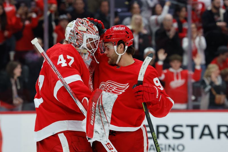 Oct 22, 2023; Detroit, Michigan, USA;  Detroit Red Wings goaltender James Reimer (47) and right wing Alex DeBrincat (93) celebrate after defeating the Calgary Flames at Little Caesars Arena. Mandatory Credit: Rick Osentoski-USA TODAY Sports