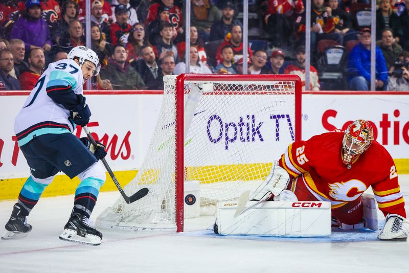 Mar 4, 2024; Calgary, Alberta, CAN; Calgary Flames goaltender Jacob Markstrom (25) makes a save against Seattle Kraken center Yanni Gourde (37) during the third period at Scotiabank Saddledome. Mandatory Credit: Sergei Belski-USA TODAY Sports