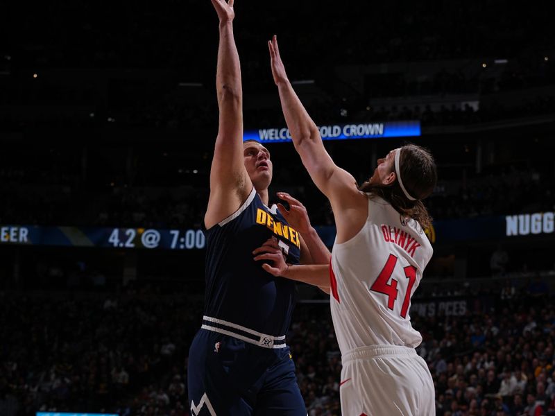 DENVER, CO - MARCH 11: Nikola Jokic #15 of the Denver Nuggets shoots the ball over Kelly Olynyk #41 of the Toronto Raptor during the game on March 11, 2024 at the Ball Arena in Denver, Colorado. NOTE TO USER: User expressly acknowledges and agrees that, by downloading and/or using this Photograph, user is consenting to the terms and conditions of the Getty Images License Agreement. Mandatory Copyright Notice: Copyright 2024 NBAE (Photo by Bart Young/NBAE via Getty Images)