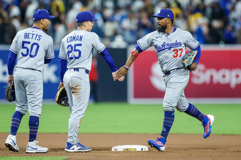 Jun 9, 2025; San Diego, California, USA; Los Angeles Dodgers right fielder Teoscar Hernandez (37) celebrates with Los Angeles Dodgers second baseman Tommy Edman (25) after defeating the San Diego Padres at Petco Park. Mandatory Credit: David Frerker-Imagn Images