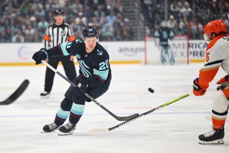 Nov 27, 2024; Seattle, Washington, USA; Seattle Kraken right wing Eeli Tolvanen (20) plays the puck during the first period against the Anaheim Ducks at Climate Pledge Arena. Mandatory Credit: Steven Bisig-Imagn Images