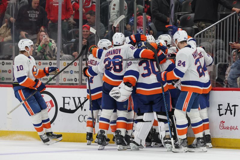 Nov 10, 2025; Newark, New Jersey, USA; New York Islanders center Mathew Barzal (13) celebrates his game winning goal against the New Jersey Devils during overtime at Prudential Center. Mandatory Credit: Ed Mulholland-Imagn Images