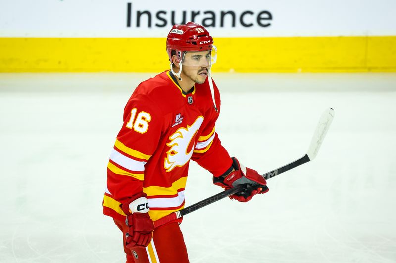 Sep 23, 2025; Calgary, Alberta, CAN; Calgary Flames center Morgan Frost (16) skates during the warmup period against the Seattle Kraken at Scotiabank Saddledome. Mandatory Credit: Sergei Belski-Imagn Images