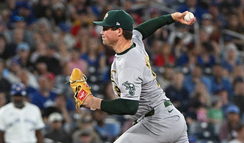 Aug 11, 2024; Toronto, Ontario, CAN; Oakland Athletics pitcher Mason Miller (19) pitches in the ninth inning against the Toronto Blue Jays at Rogers Centre. Mandatory Credit: Gerry Angus-USA TODAY Sports