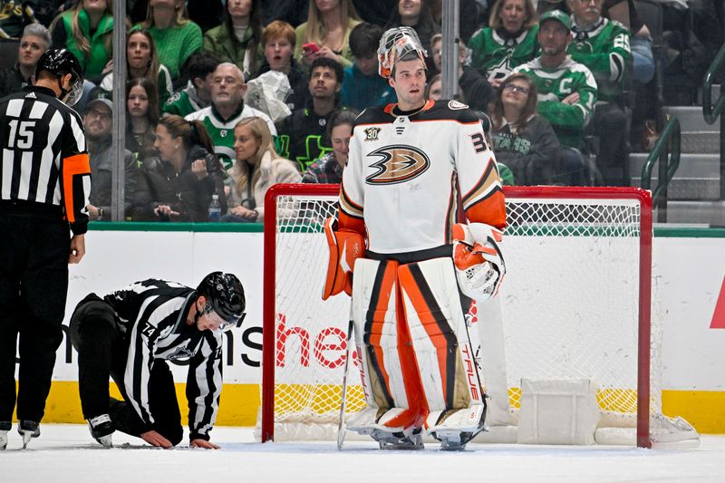 Jan 25, 2024; Dallas, Texas, USA; Anaheim Ducks goaltender John Gibson (36) looks to the Ducks bench as the lineman fix the net during the third period against the Anaheim Ducks at the American Airlines Center. Mandatory Credit: Jerome Miron-USA TODAY Sports