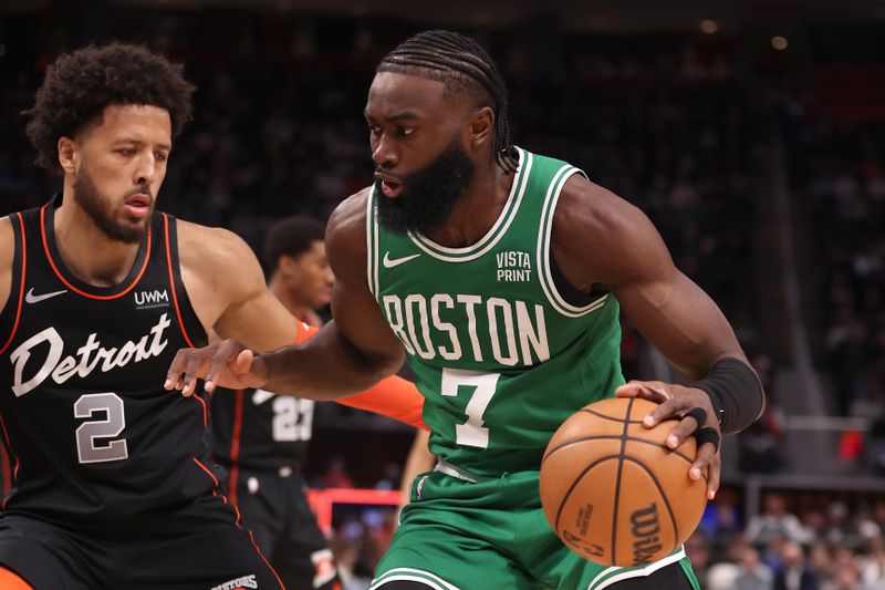 DETROIT, MICHIGAN - MARCH 22: Jaylen Brown #7 of the Boston Celtics drives around Cade Cunningham #2 of the Detroit Pistons during the first half at Little Caesars Arena on March 22, 2024 in Detroit, Michigan. NOTE TO USER: User expressly acknowledges and agrees that, by downloading and or using this photograph, User is consenting to the terms and conditions of the Getty Images License. (Photo by Gregory Shamus/Getty Images)