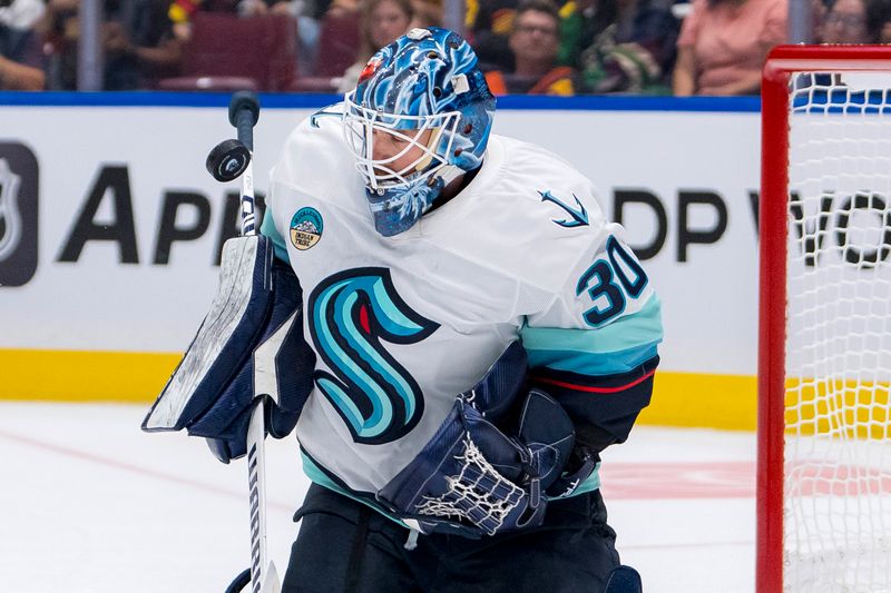 Sep 24, 2024; Vancouver, British Columbia, CAN; Seattle Kraken goalie Ales Stezka (30) makes a save against the Vancouver Canucks during the third period at Rogers Arena. Mandatory Credit: Bob Frid-Imagn Images