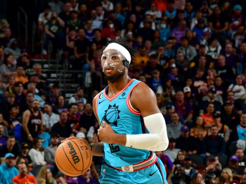 PHOENIX, AZ - MARCH 14: Josh Okogie #2 of the Phoenix Suns dribbles the ball during the game against the Milwaukee Bucks on March 14, 2022 at Footprint Center in Phoenix, Arizona. NOTE TO USER: User expressly acknowledges and agrees that, by downloading and or using this photograph, user is consenting to the terms and conditions of the Getty Images License Agreement. Mandatory Copyright Notice: Copyright 2022 NBAE (Photo by Kate Frese/NBAE via Getty Images)