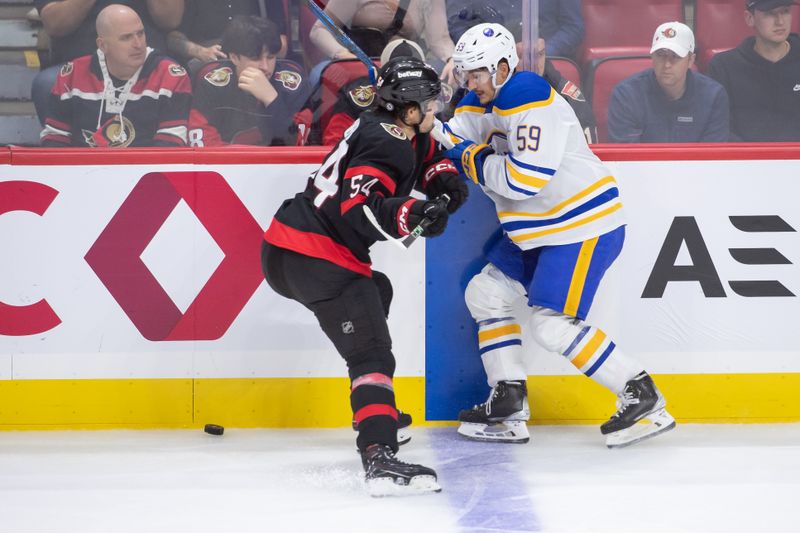 Sep 26, 2024; Ottawa, Ontario, CAN; Ottawa Senators right wing Tyler Boucher (54) takes Buffalo Sabres right wing Tyler Tullio (59) off the puck in the third period at the Canadian Tire Centre. Mandatory Credit: Marc DesRosiers-Imagn Images