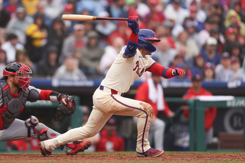 May 14, 2025; Philadelphia, Pennsylvania, USA; Philadelphia Phillies second base Bryson Stott (5) this an RBI single during the seventh inning against the St. Louis Cardinals at Citizens Bank Park. Mandatory Credit: Bill Streicher-Imagn Images