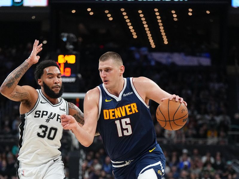 AUSTIN, TX - MARCH 15: Nikola Jokic #15 of the Denver Nuggets drives to the basket during the game against the San Antonio Spurs on March 15, 2024 at the Moody Center in Austin, Texas. NOTE TO USER: User expressly acknowledges and agrees that, by downloading and/or using this Photograph, user is consenting to the terms and conditions of the Getty Images License Agreement. Mandatory Copyright Notice: Copyright 2024 NBAE (Photo by Garrett Ellwood/NBAE via Getty Images)