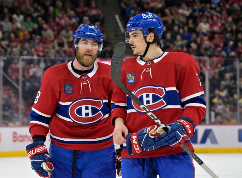 Mar 9, 2024; Montreal, Quebec, CAN; Montreal Canadiens defenseman David Savard (58) talks to teammate defenseman Arber Xhekaj (72) during the second period of the game against the Toronto Maple Leafs at the Bell Centre. Mandatory Credit: Eric Bolte-USA TODAY Sports