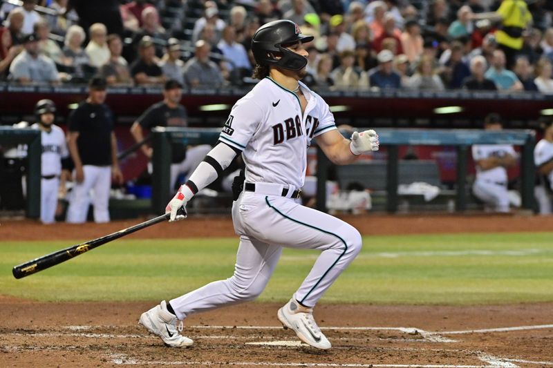Sep 20, 2023; Phoenix, Arizona, USA;  Arizona Diamondbacks center fielder Alek Thomas (5) hits an RBI double in the third inning against the San Francisco Giants at Chase Field. Mandatory Credit: Matt Kartozian-USA TODAY Sports