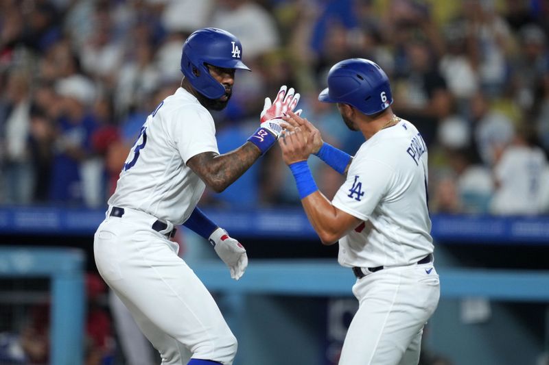 Aug 29, 2023; Los Angeles, California, USA; Los Angeles Dodgers right fielder Jason Heyward (23) celebrates with designated hitter David Peralta (6) after hitting a two-run home run in the third inning against the Arizona Diamondbacks at Dodger Stadium. Mandatory Credit: Kirby Lee-USA TODAY Sports