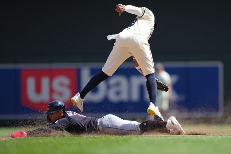 Aug 11, 2024; Minneapolis, Minnesota, USA; Cleveland Guardians second baseman Andres Gimenez (0) steals second base during the sixth inning against the Minnesota Twins at Target Field. Mandatory Credit: Jordan Johnson-USA TODAY Sports