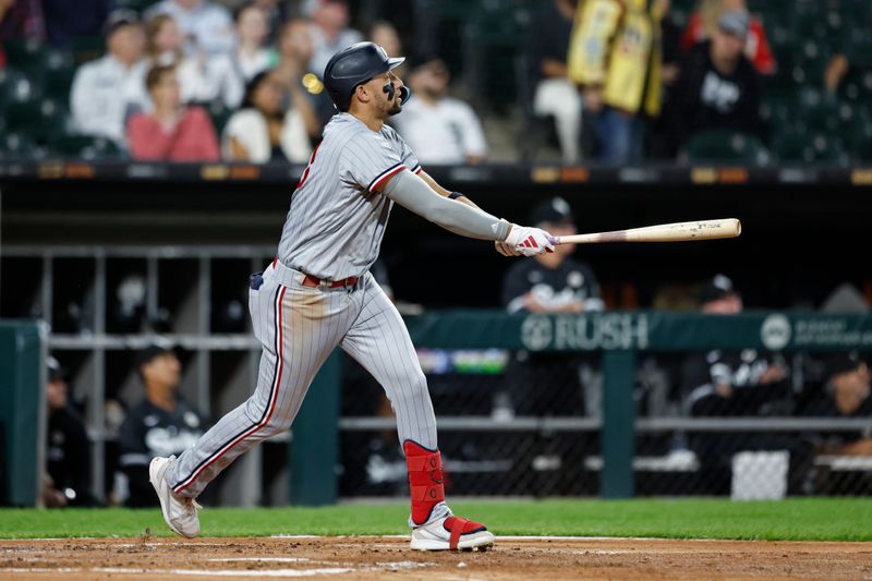 Sep 15, 2023; Chicago, Illinois, USA; Minnesota Twins third baseman Royce Lewis (23) watches his grand slam against the Chicago White Sox during the second inning at Guaranteed Rate Field. Mandatory Credit: Kamil Krzaczynski-USA TODAY Sports